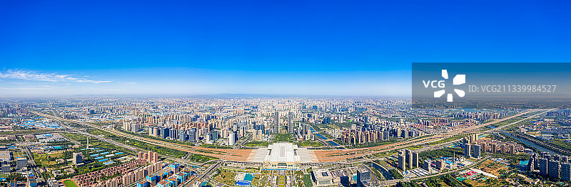 河南郑州高铁站郑州东站都市风光城市天际线夏季户外航拍视角全景图片素材