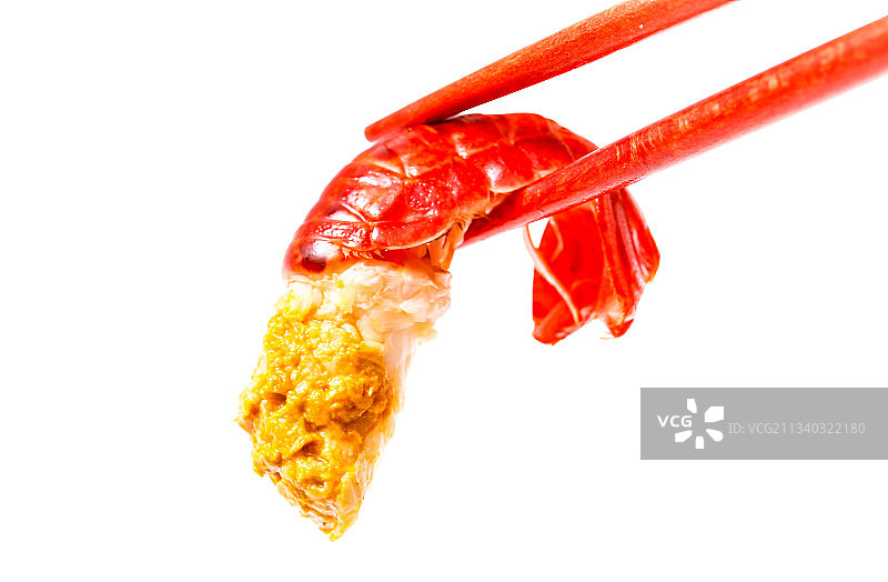 筷子上夹着龙虾尾图片素材