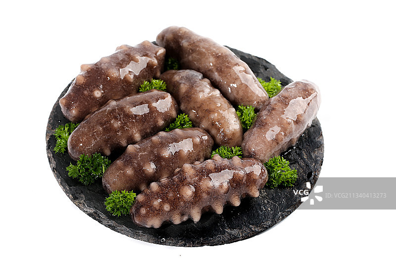 一盘刺参放在白底上图片素材