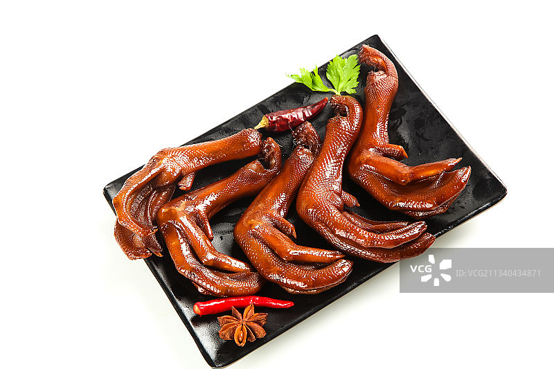 白底上放着一盘红烧鸭掌图片素材