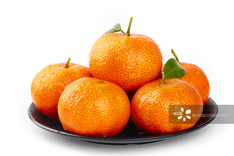 盘子里装着小蜜橘图片素材