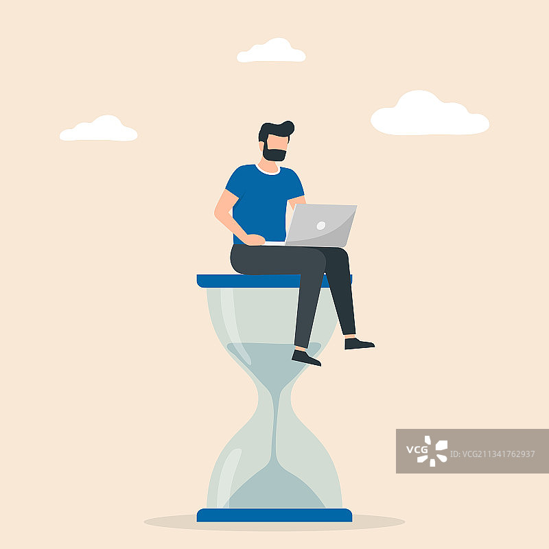 男人坐在沙漏上工作图片素材