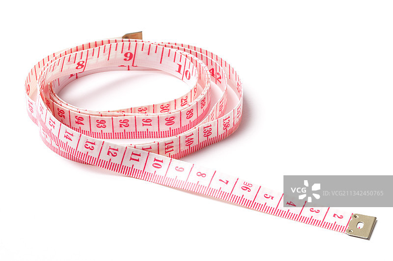 白色背景上的卷尺特写图片素材