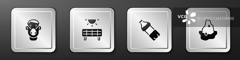 戴防护面罩的人在太阳能电池板旁图片素材