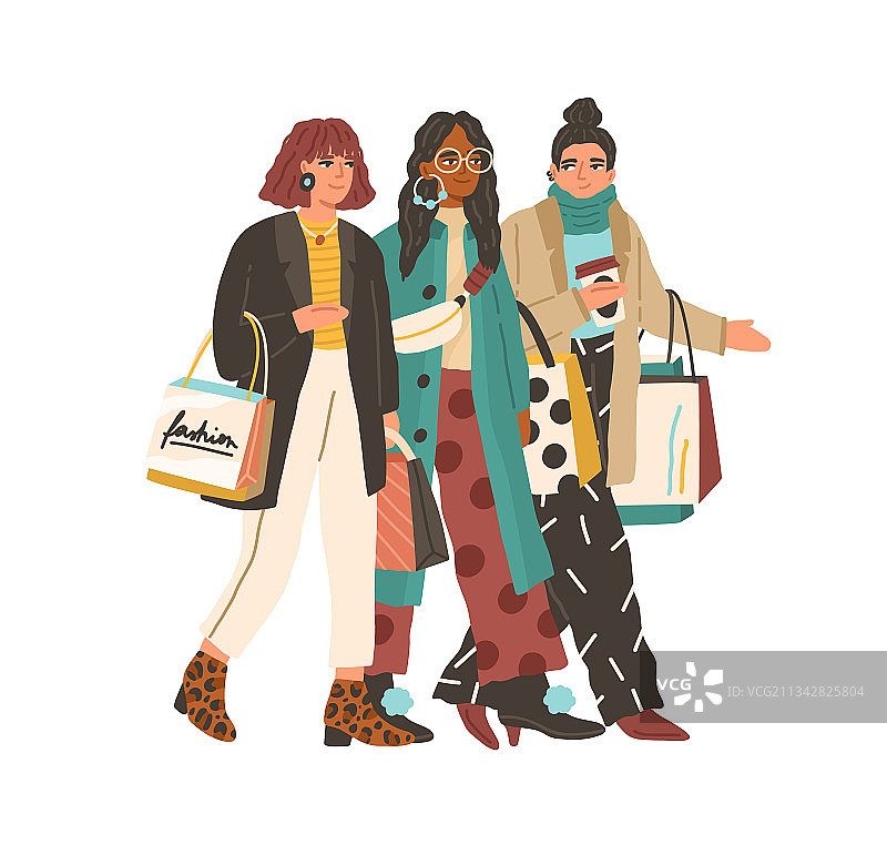快乐的时尚女人们带着购物袋走路图片素材