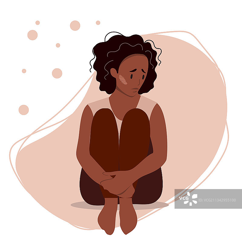 坐在地板上的悲伤女人图片素材