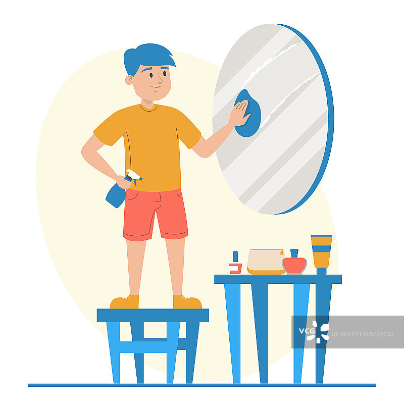 孩子用抹布和喷雾擦拭镜子图片素材