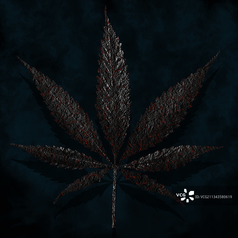 深蓝色背景下的烧焦大麻叶图片素材
