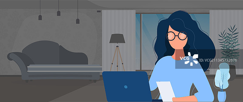 戴眼镜的女孩坐在办公室的桌子旁图片素材