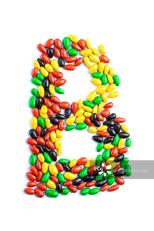 白色背景上的彩色糖果高角度视图图片素材