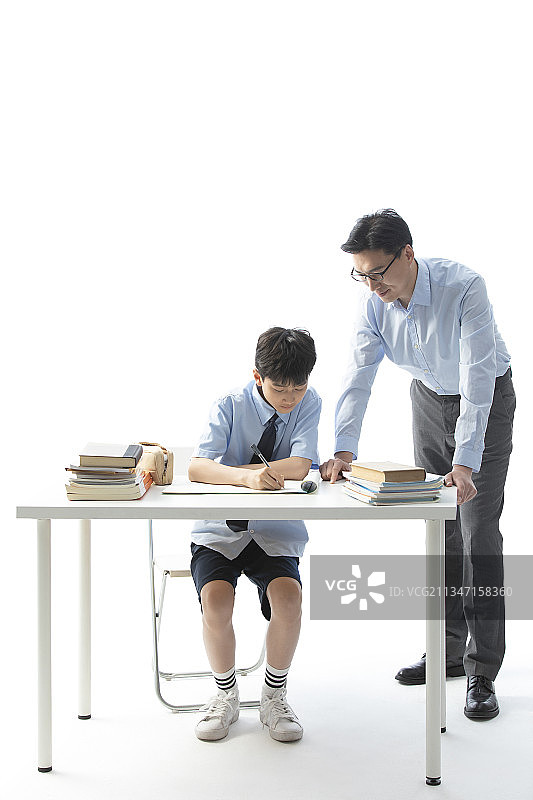 老师给学生辅导功课图片素材