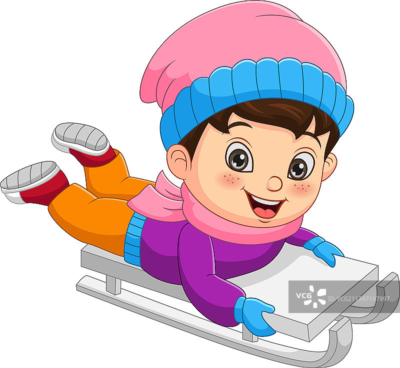 可爱的小男孩在山坡上滑雪图片素材