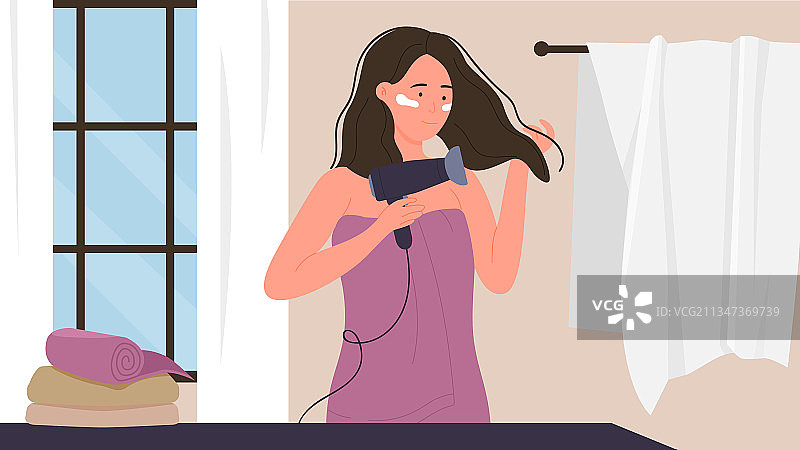 在浴室用吹风机的女孩图片素材