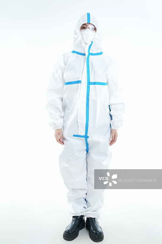 穿白色防护服佩戴护目镜口罩的女性医疗人员图片素材