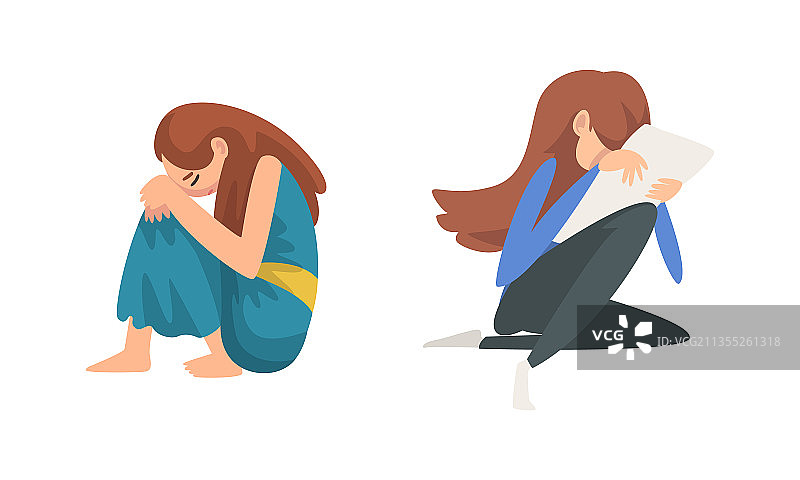 坐在地板上感到悲伤的少女图片素材