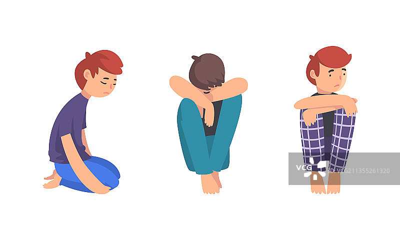 坐在地板上感到不高兴的悲伤的青少年男孩图片素材