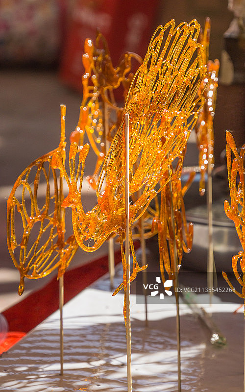 中国传统手工艺品糖人糖画特写图片素材