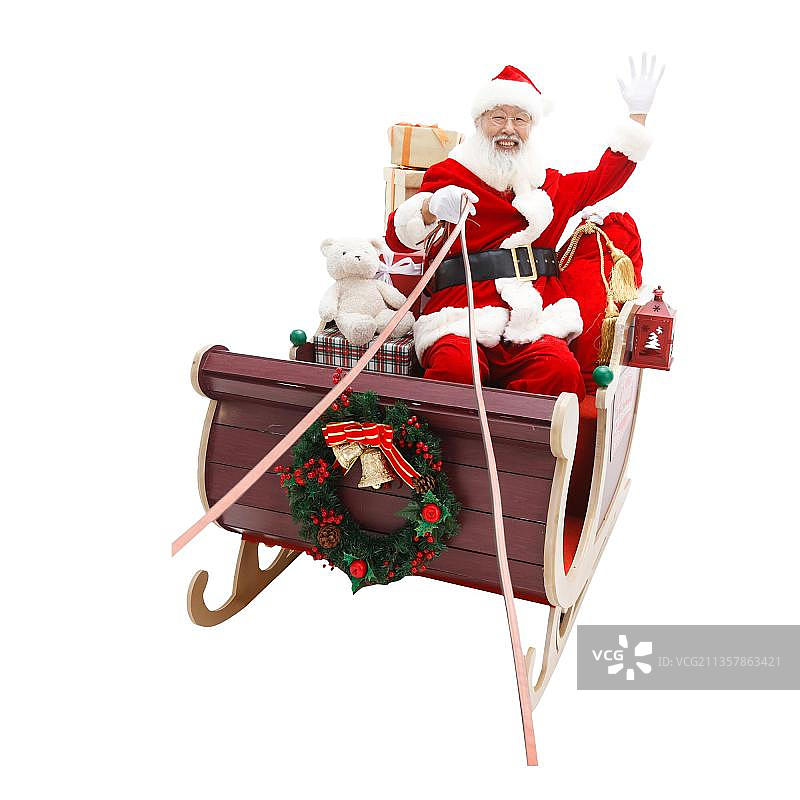 圣诞老人驾着雪橇派送礼物图片素材
