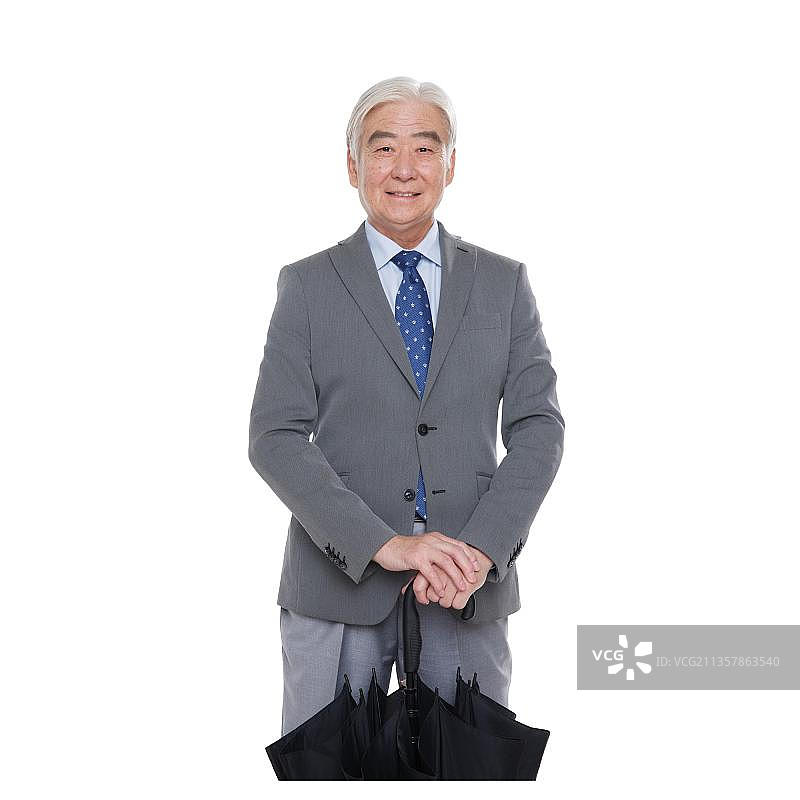 一个商务老年男人拿着伞图片素材