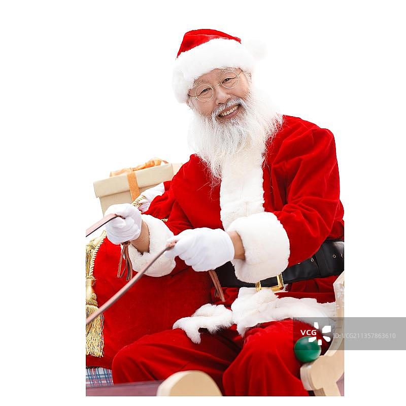 穿着圣诞服的老人坐在雪橇上图片素材
