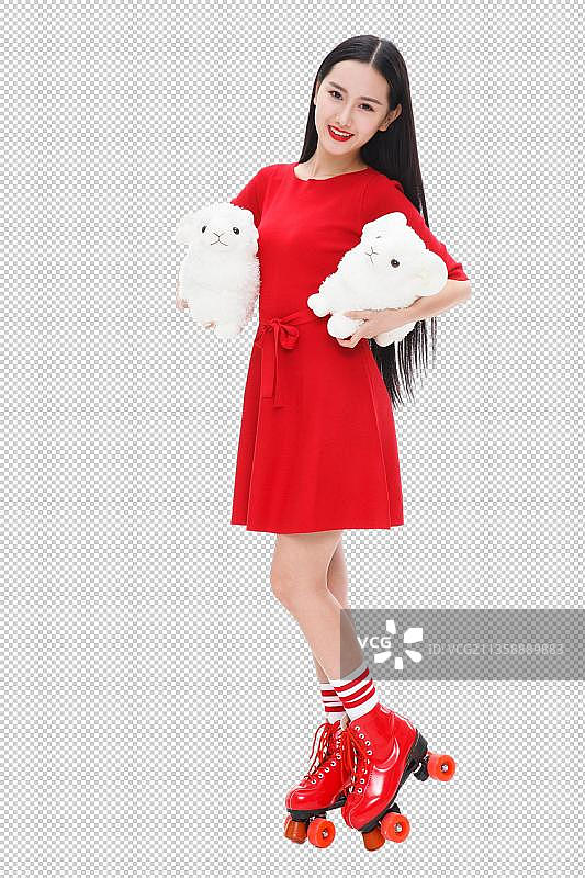 拿着毛绒玩具的年轻女人图片素材