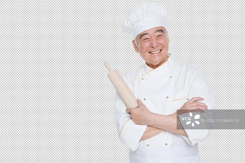 一个老年男人穿着厨师服拿着厨具图片素材