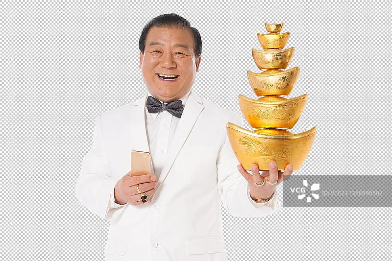 成功男人拿着金元宝图片素材