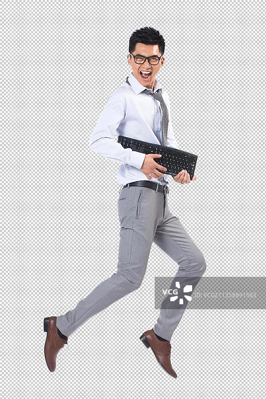 商务男士拿着键盘跳舞图片素材