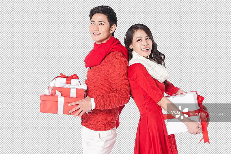 青年情侣拿着圣诞节礼物图片素材