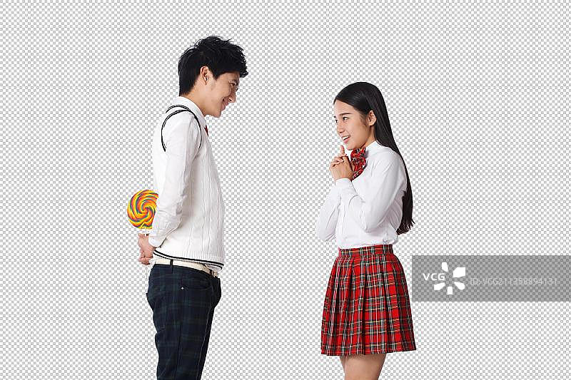 青春活力的青年学生拿着棒棒糖图片素材