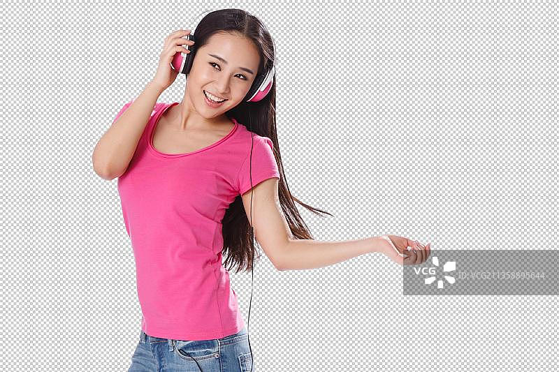 青春活力的年轻女孩听音乐图片素材