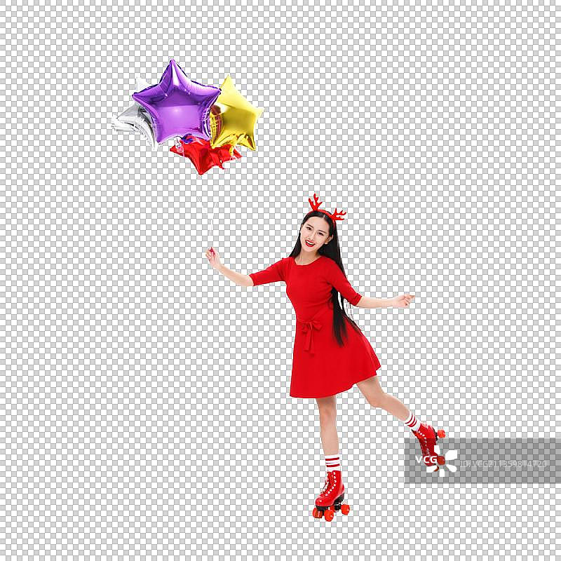 一个青年女人拿着气球在溜旱冰图片素材