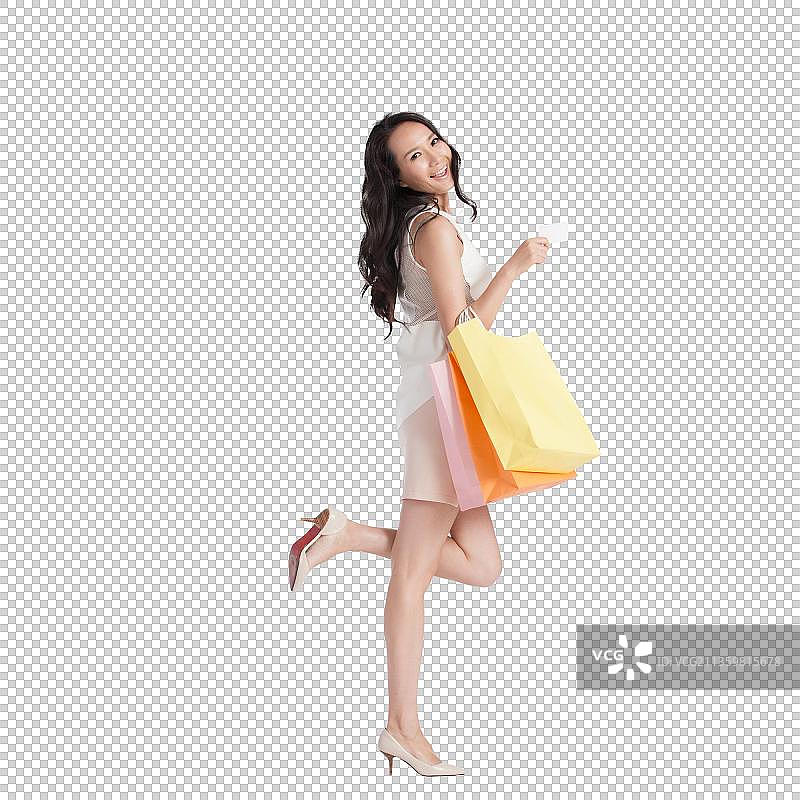 快乐的青年女白领购物图片素材