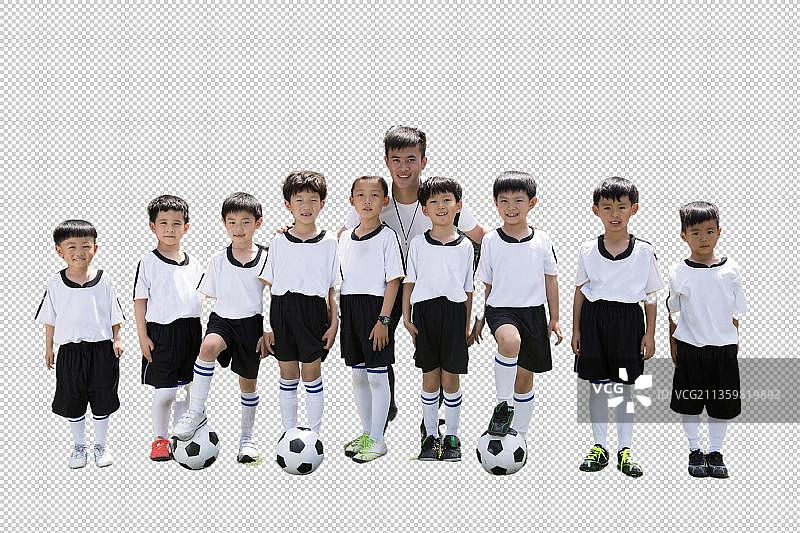 足球教练和男孩们在足球场上图片素材