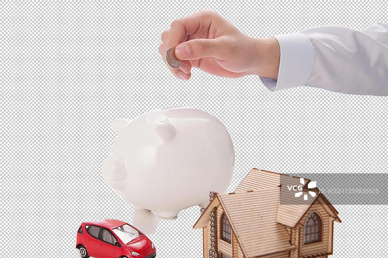 手拿硬币放入存钱罐图片素材