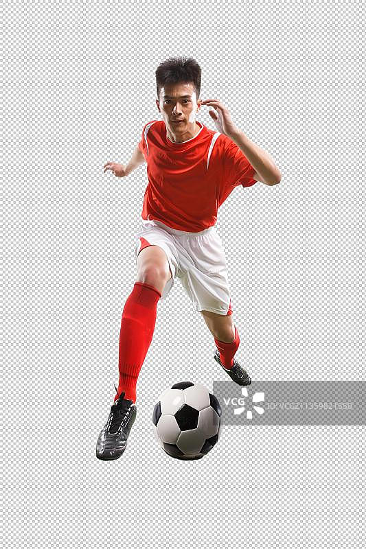 足球运动员踢球图片素材