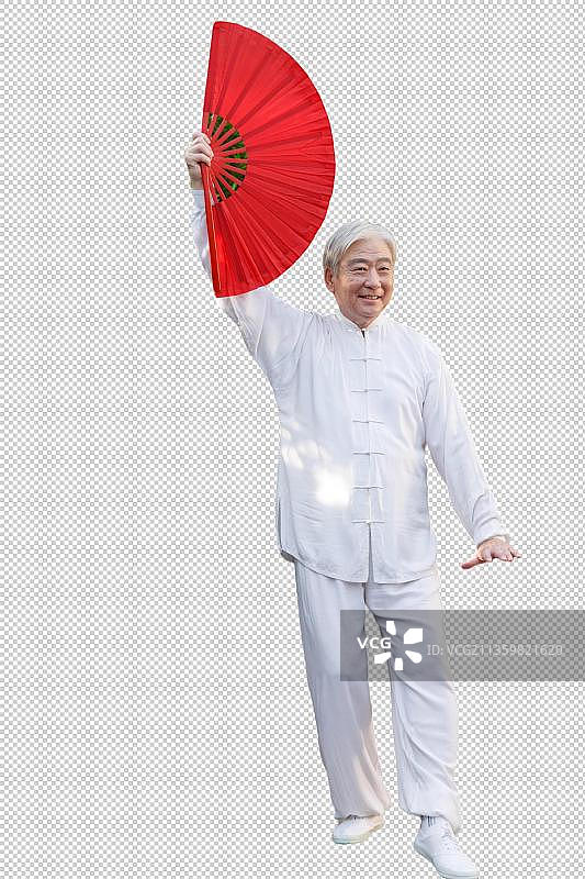 一个老年男人拿着折扇在晨练图片素材