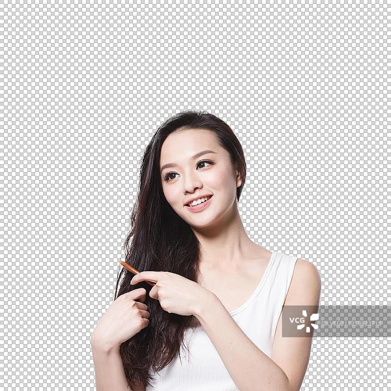 东方美女拿着梳子正在梳头图片素材