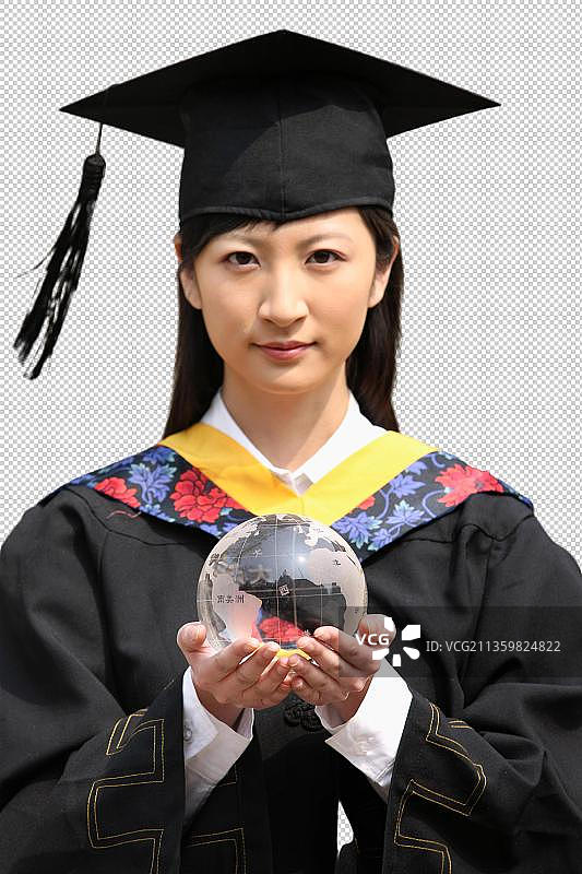 东方女孩身穿博士服手捧水晶球图片素材