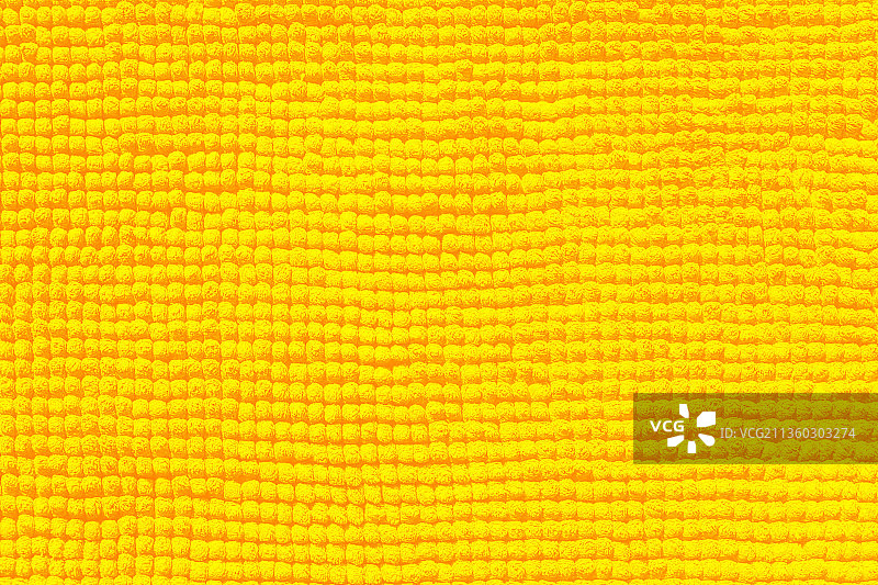 黄色毛巾特写：织物和纹理背景图片素材