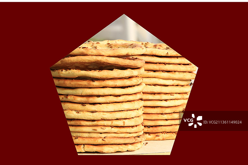 新疆特产 馕 大馍 正宗烤馕饼 芝麻油酥馕 红色背景图片素材