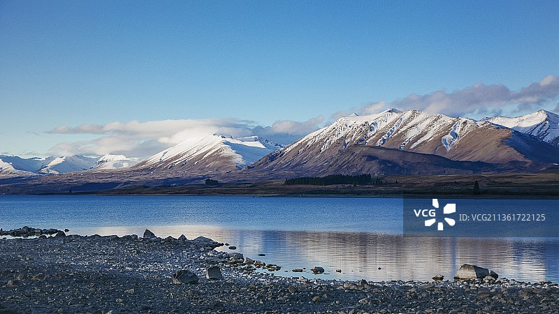 新西兰特卡波湖的冬季，雪山湖景，新加坡图片素材