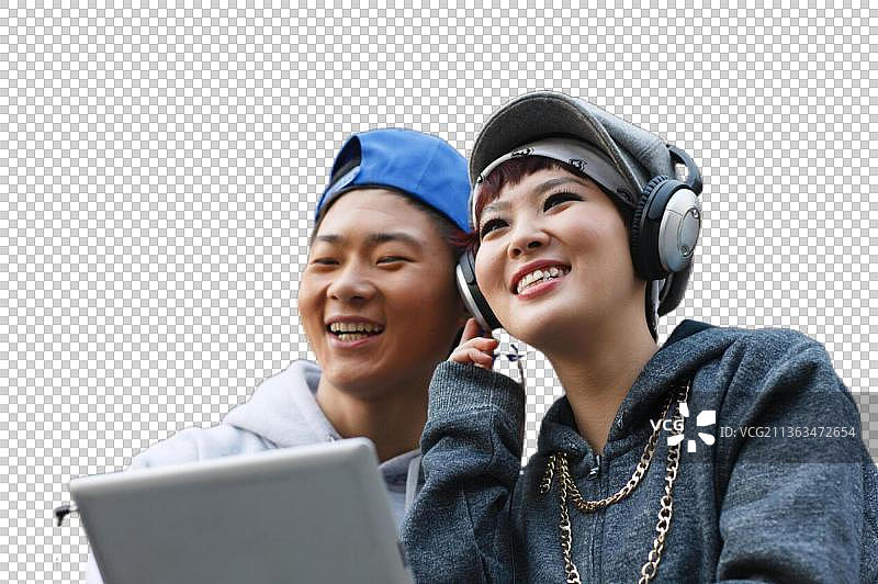 嘻哈风格的年轻人拿着平板电脑图片素材