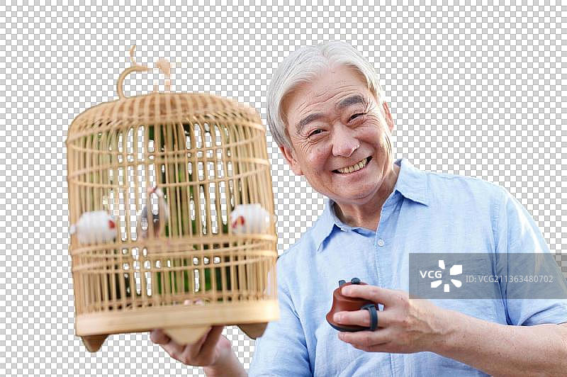 休闲的老年男人拿着鸟笼图片素材