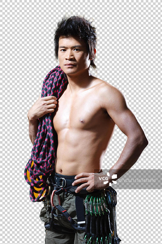 东方男人户内攀岩图片素材