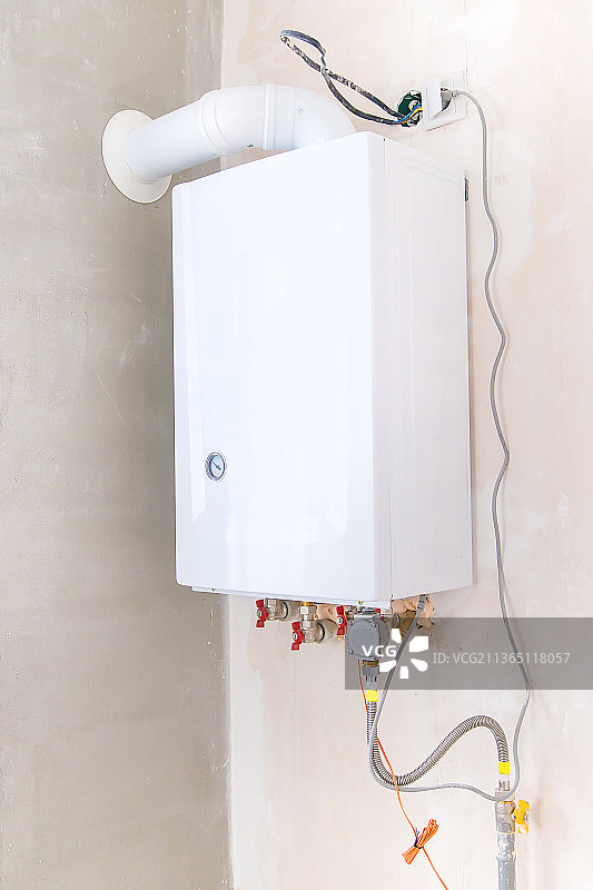 墙上的燃气锅炉特写图片素材