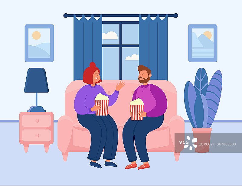 可爱的夫妇在舒适的房子里看电影图片素材