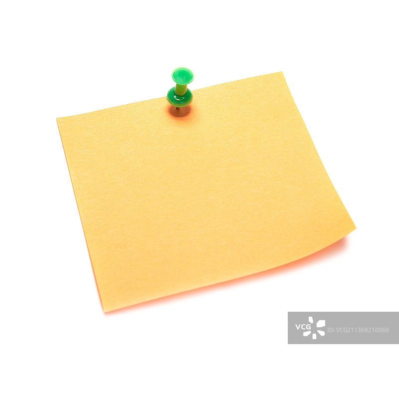 图钉固定的橙色便签特写图片素材