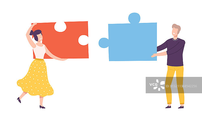 年轻男女拿着巨大的拼图图片素材