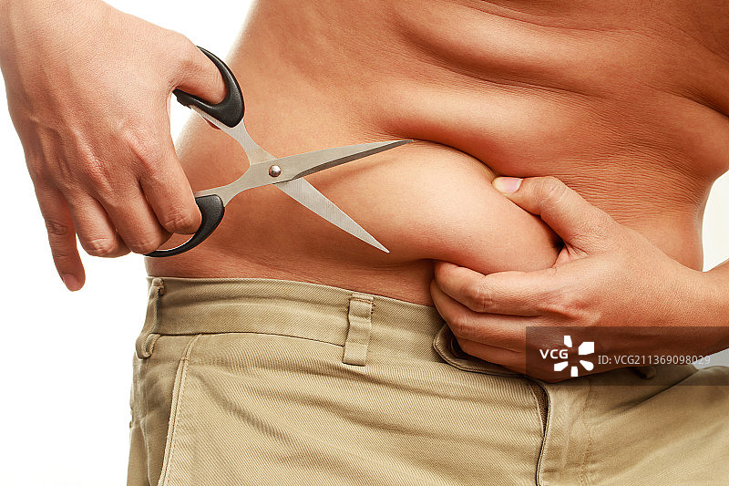 超重的胖男人正在节食减肥图片素材